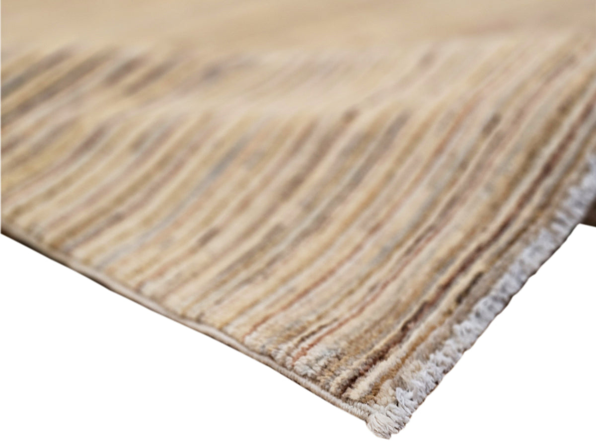 Beige and brown striped rug corner with short fringed edges and textured pile