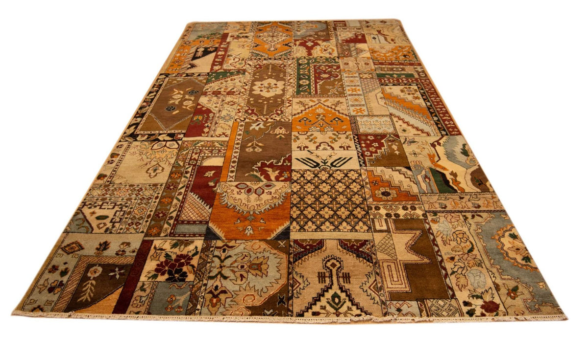 Rectangular patchwork area rug with warm brown, orange, and cream geometric blocks