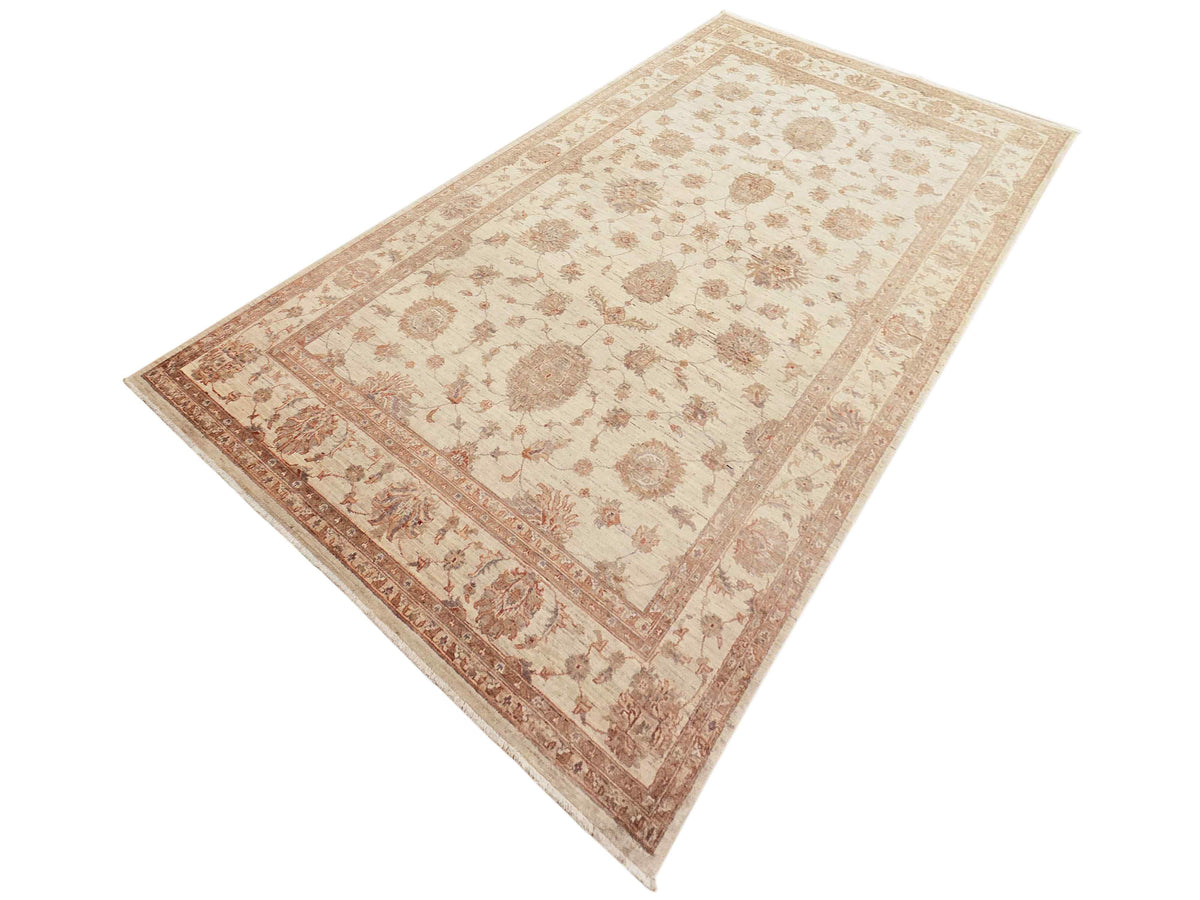 Beige and rust floral rug with diamond border, diagonal corner-to-corner view.