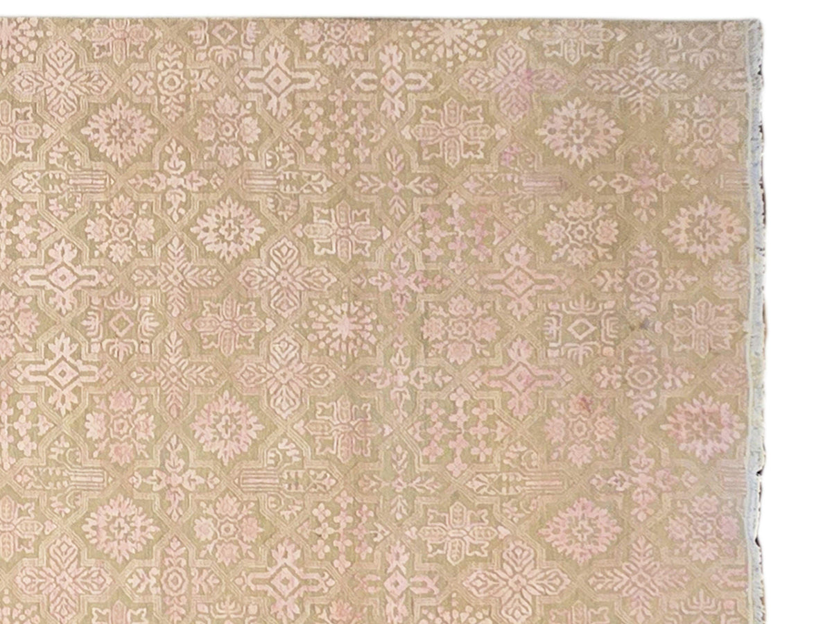 Beige rug with cream and pink repeating pattern and simple border edge