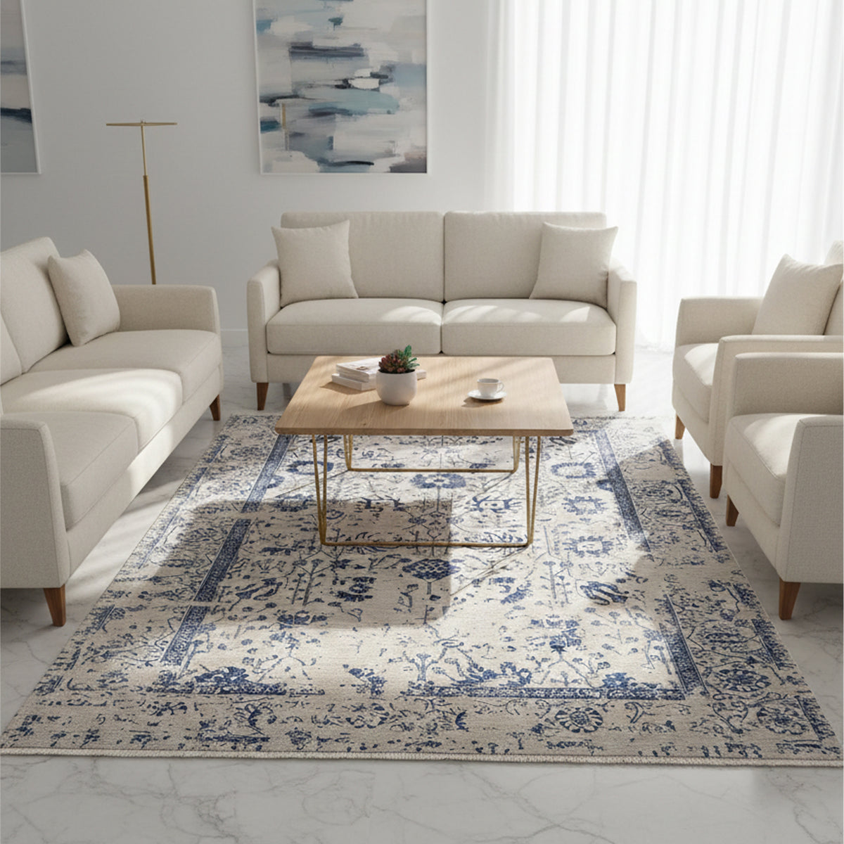 Beige and blue patterned area rug with ornate border, flatweave style.