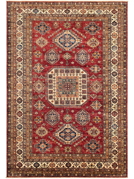 Red rug with symmetrical medallion layout, cream framing, and dark blue details