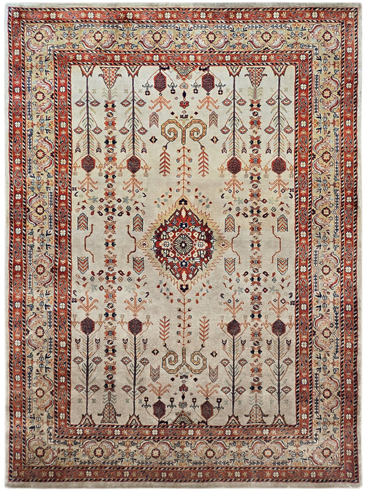 Full view rectangular rug with cream field, red medallion, and navy accents