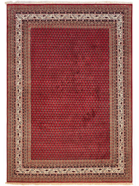 Red Indo Mir area rug with ornate geometric border and patterned center, rectangular