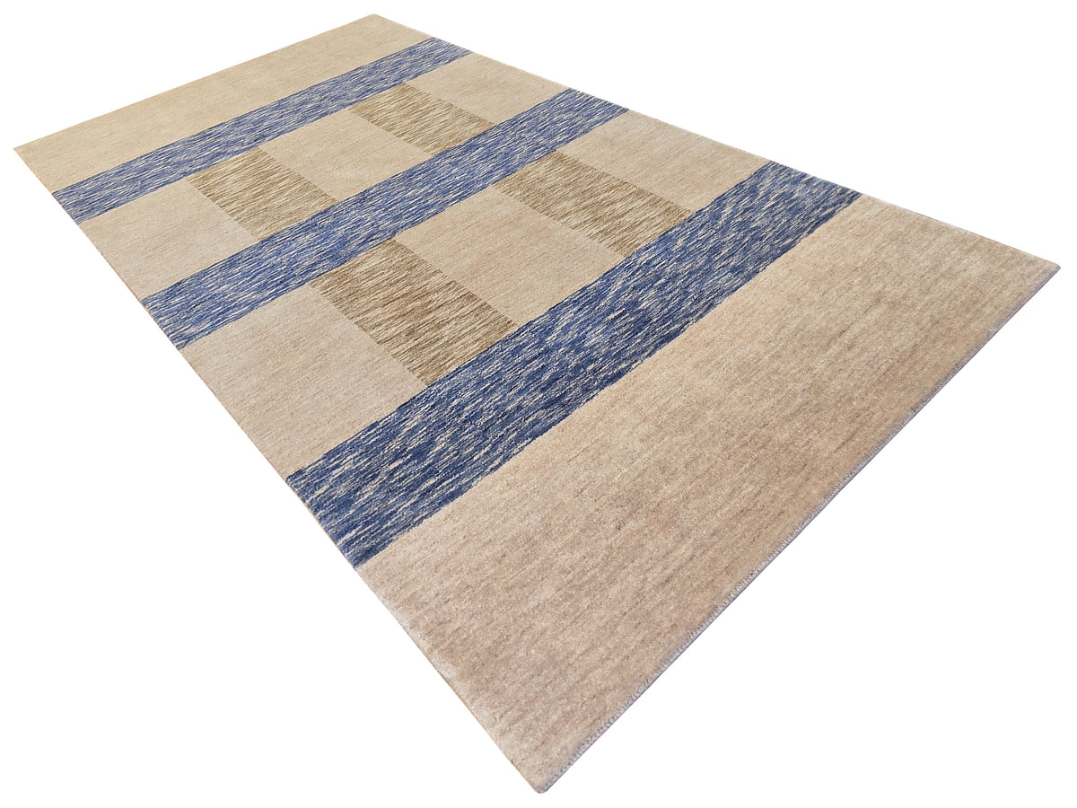 Beige handloom rug with blue diamond/check blocks and subtle texture