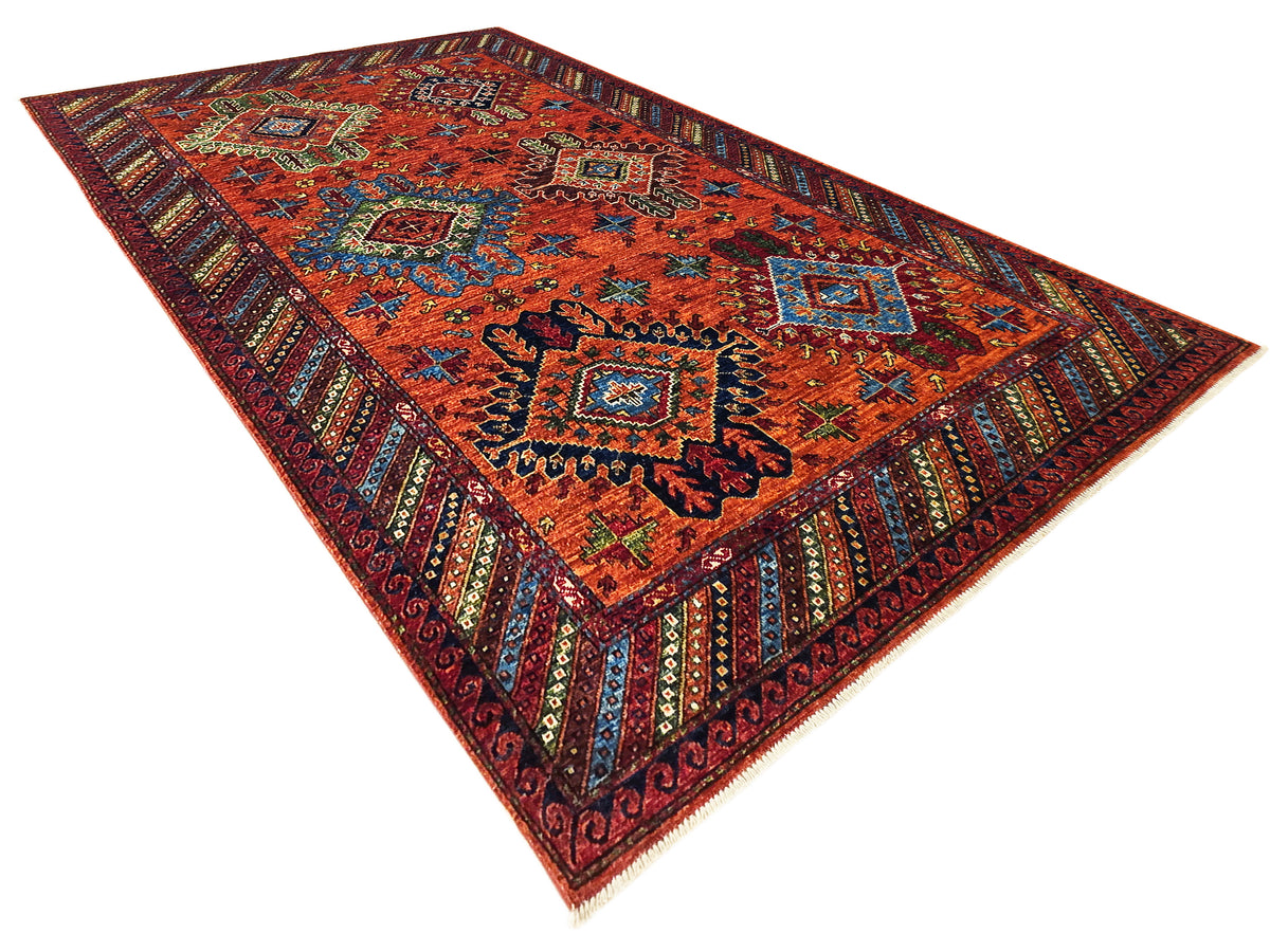 Rectangular 245x172 cm rug with red-orange background, blue and green accents, ornate border