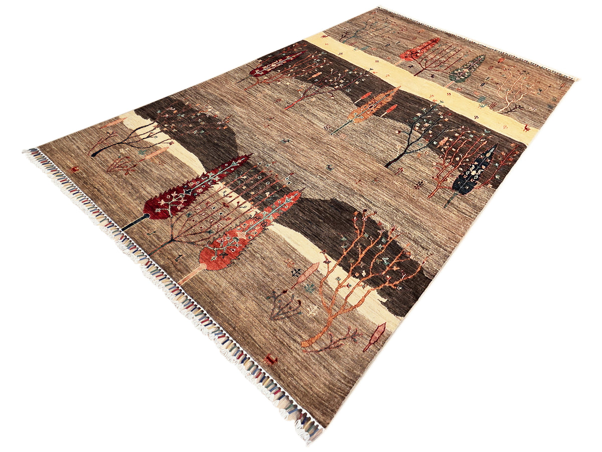 Patterned area rug with repeating tree scenes, brown and cream panels with red accents, fringes