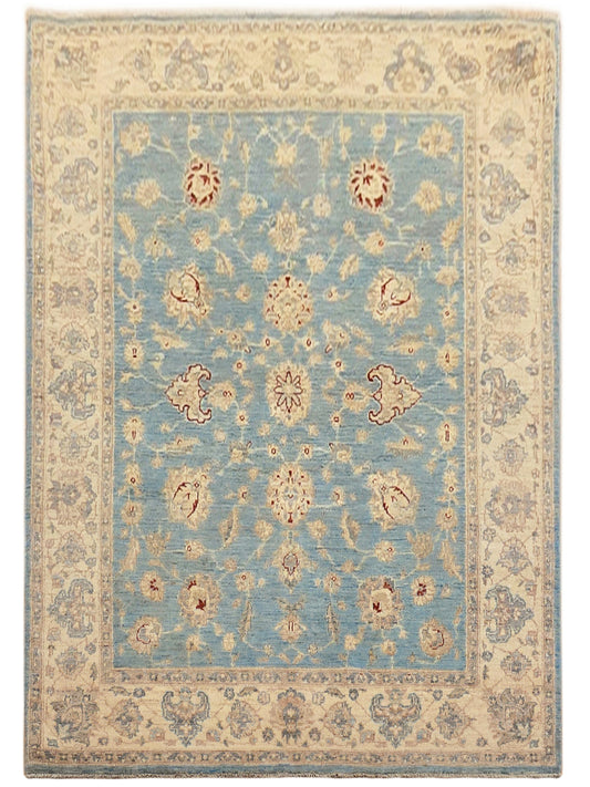 Rectangular light blue area rug with cream frame border and scattered florals